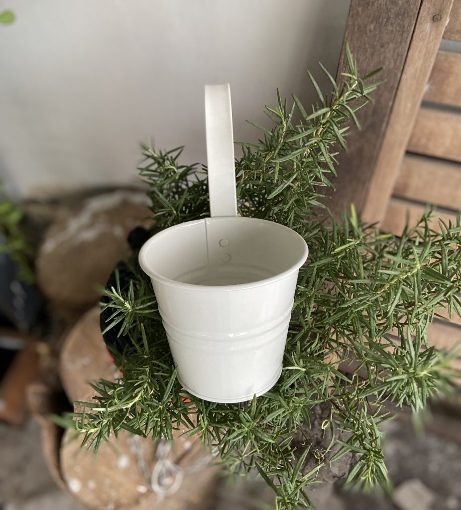 Galvanized, orange hanging pots Small wall hanging pots with many
